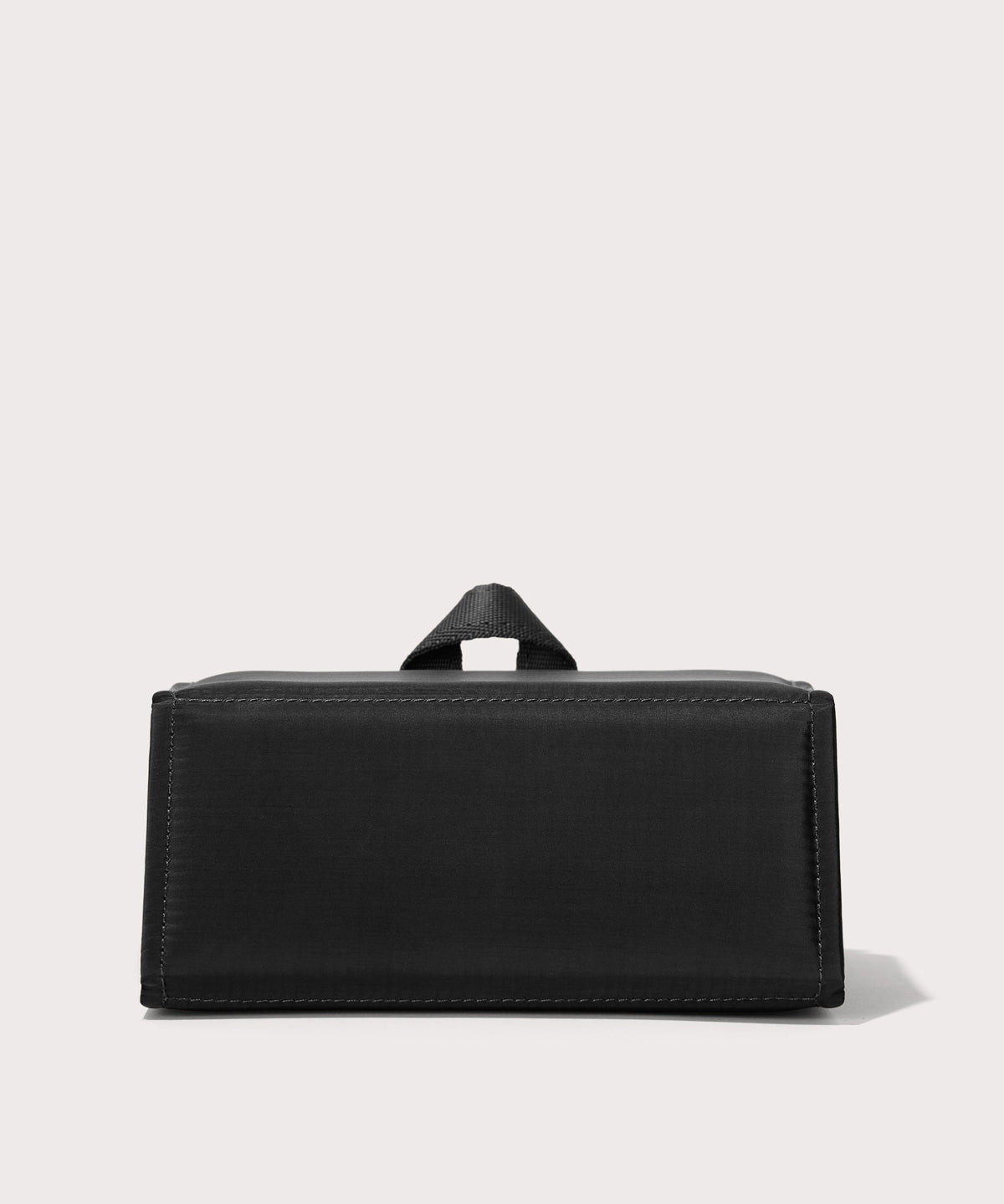Dagne Dover Remi foldable glasses holder in black seen from the back.