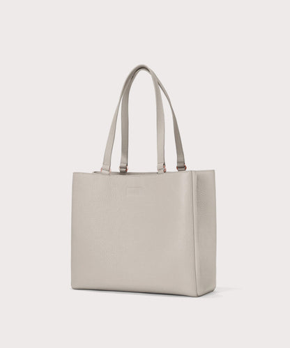 Dagne Dover medium Allyn Tote in light grey seen from an angle.