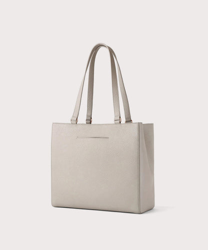 Dagne Dover medium Allyn Tote in light grey with the exterior slip pocket.