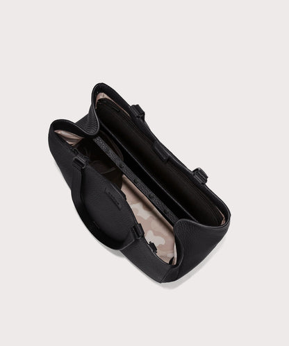 Dagne Dover medium Allyn Tote in black seen from above, revealing the interior slip pockets and laptop sleeve.