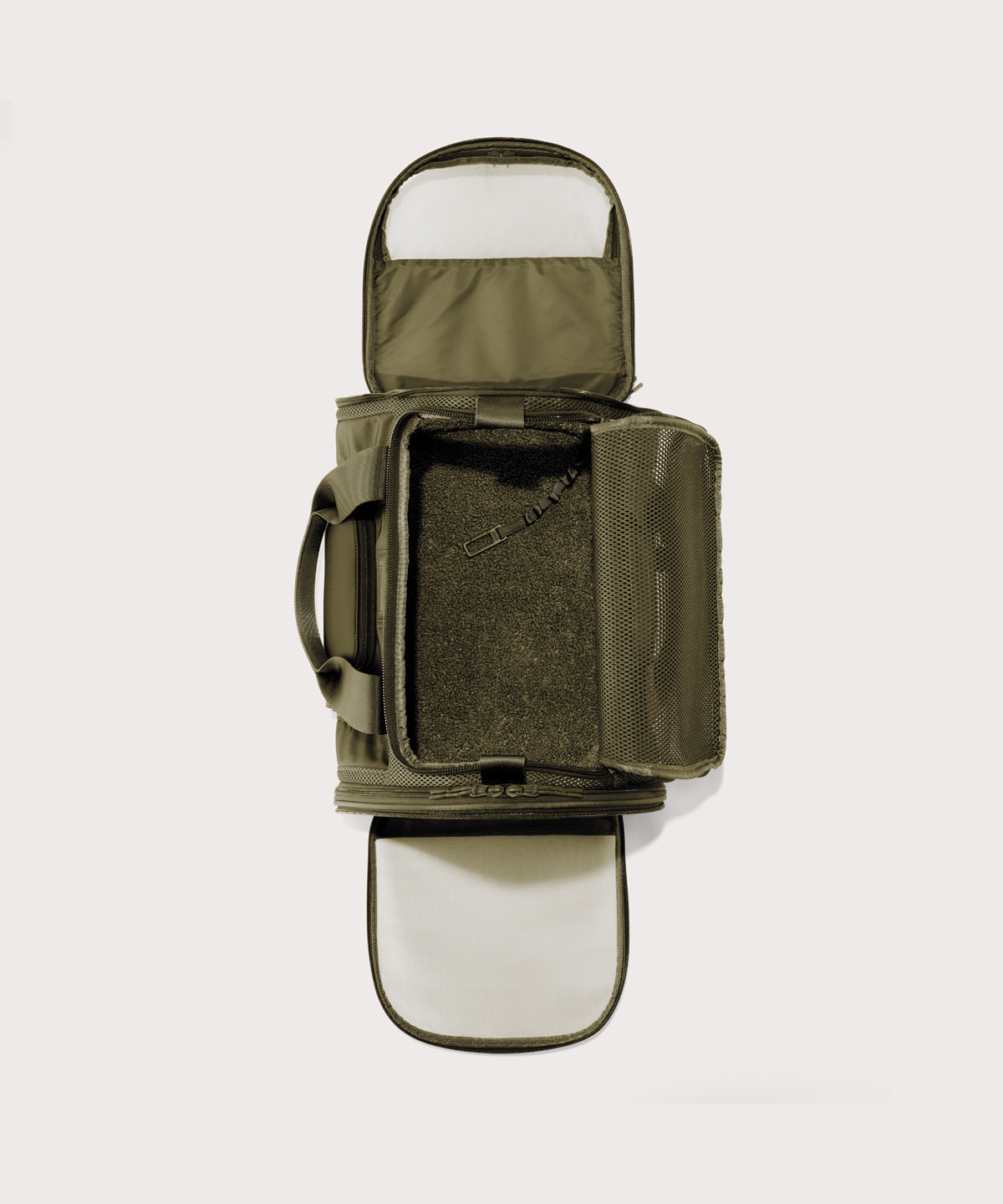 Dagne Dover Large Kyoto Pet Carrier in a deep olive green seen unzipped, top down view.