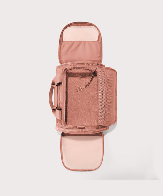 Dagne Dover Large Kyoto Pet Carrier in a warm dust pink seen unzipped, top down view.