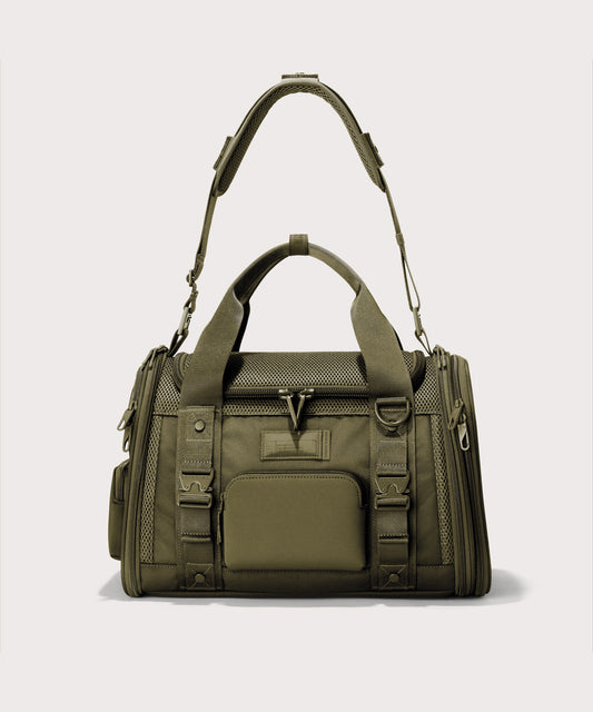 Dagne Dover small Kyoto Pet Carrier in a deep olive green seen from the front with crossbody strap.