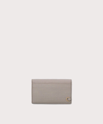 Dagne Dover vegan Card Case in light grey seen from the back revealing the one external card slot.