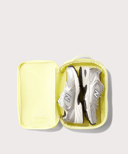 medium Roma packing cube in citrine open with jeans inside