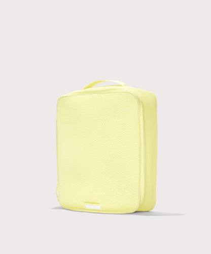 3/4 view of extra large Roma packing cube in citrine