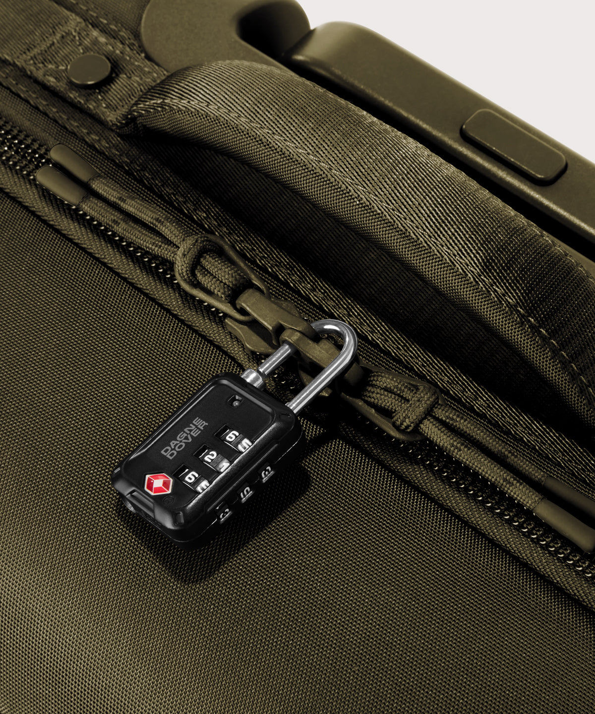 Detail shot of Seattle carry-on rolling luggage 20.5” in dark green lockable zipper heads. Lock not included.