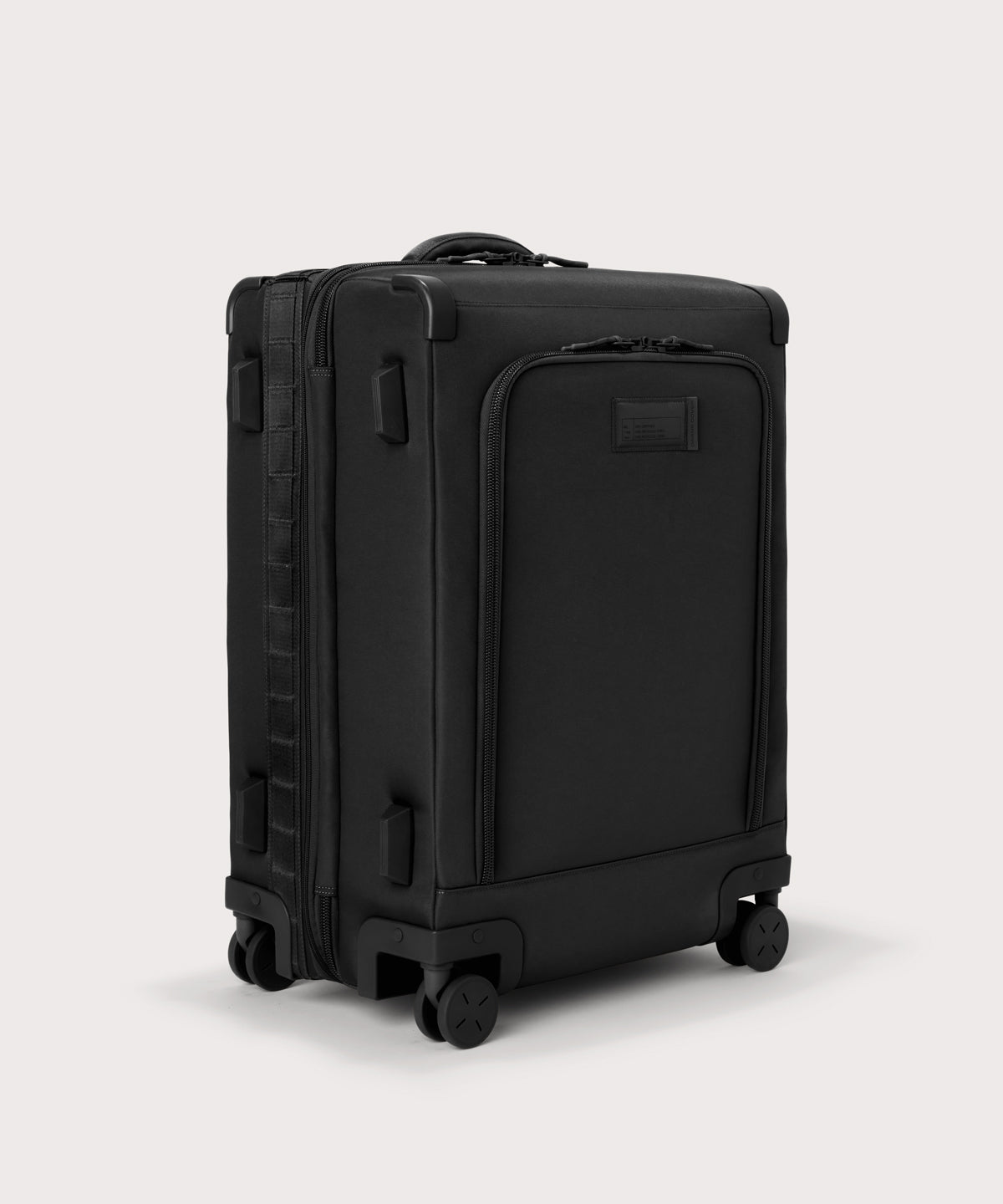 3/4 front view of Sydney checked rolling luggage 25" in black showing side luggage feet